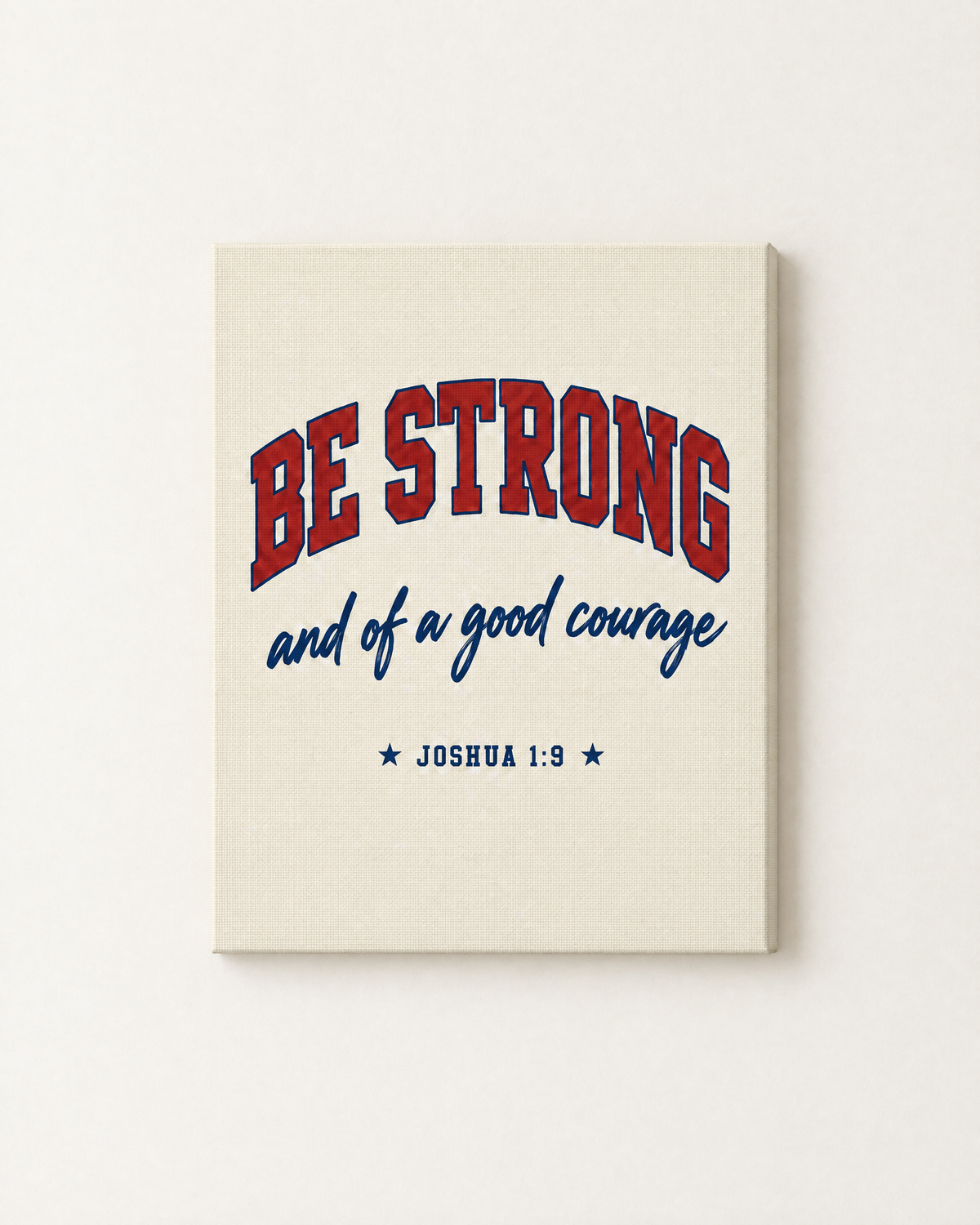 Be Strong: Varsity print as a gallery-wrapped canvas on a white wall, reading “Be strong and of a good courage” (Joshua 1:9, KJV). Digital mockup.