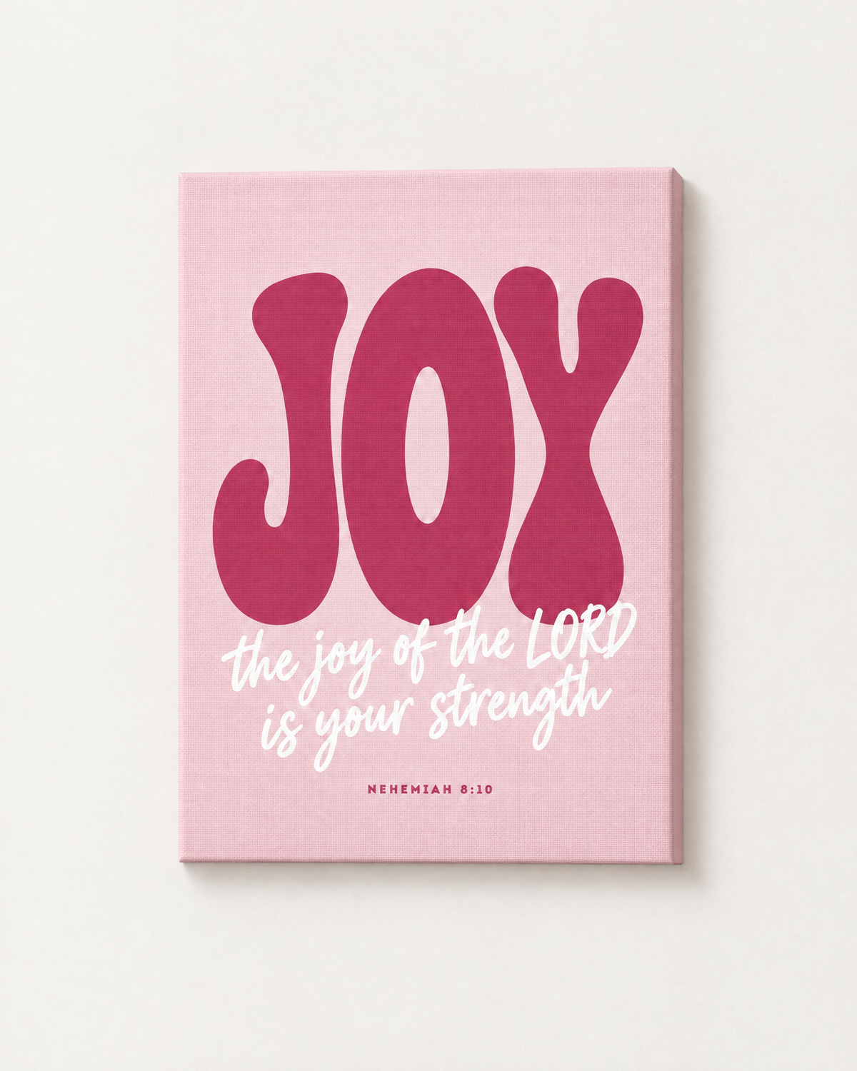Joy: Blush print as a gallery-wrapped canvas on a white wall, reading “The joy of the LORD is your strength” (Nehemiah 8:10, KJV). Digital mockup.