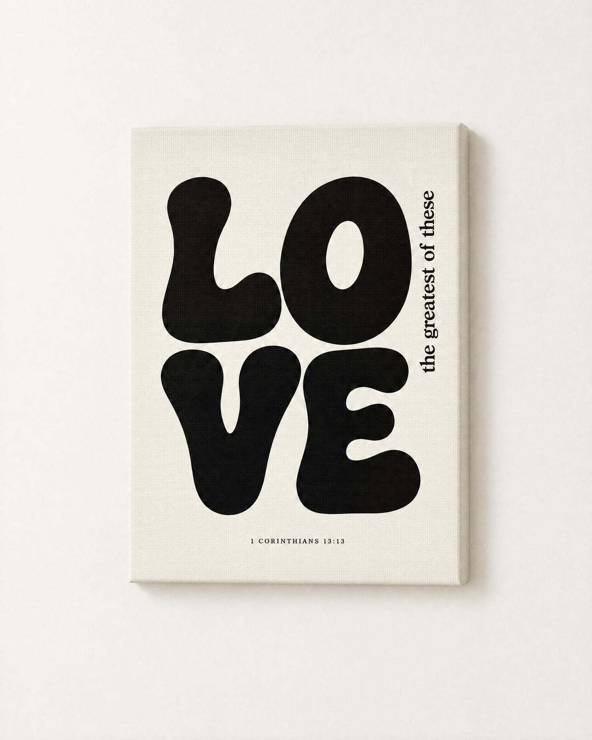 Love: Black & White print as a gallery-wrapped canvas on a white wall, reading “the greatest of these” (1 Corinthians 13:13, KJV). Digital mockup.