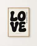 Love: Black & White print in an oak frame on a white wall, reading “the greatest of these” (1 Corinthians 13:13, KJV). Digital mockup.