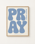 Pray: Dusty Blue print in an oak frame on a white wall, reading “Pray without ceasing” (1 Thessalonians 5:17, KJV). Digital mockup.