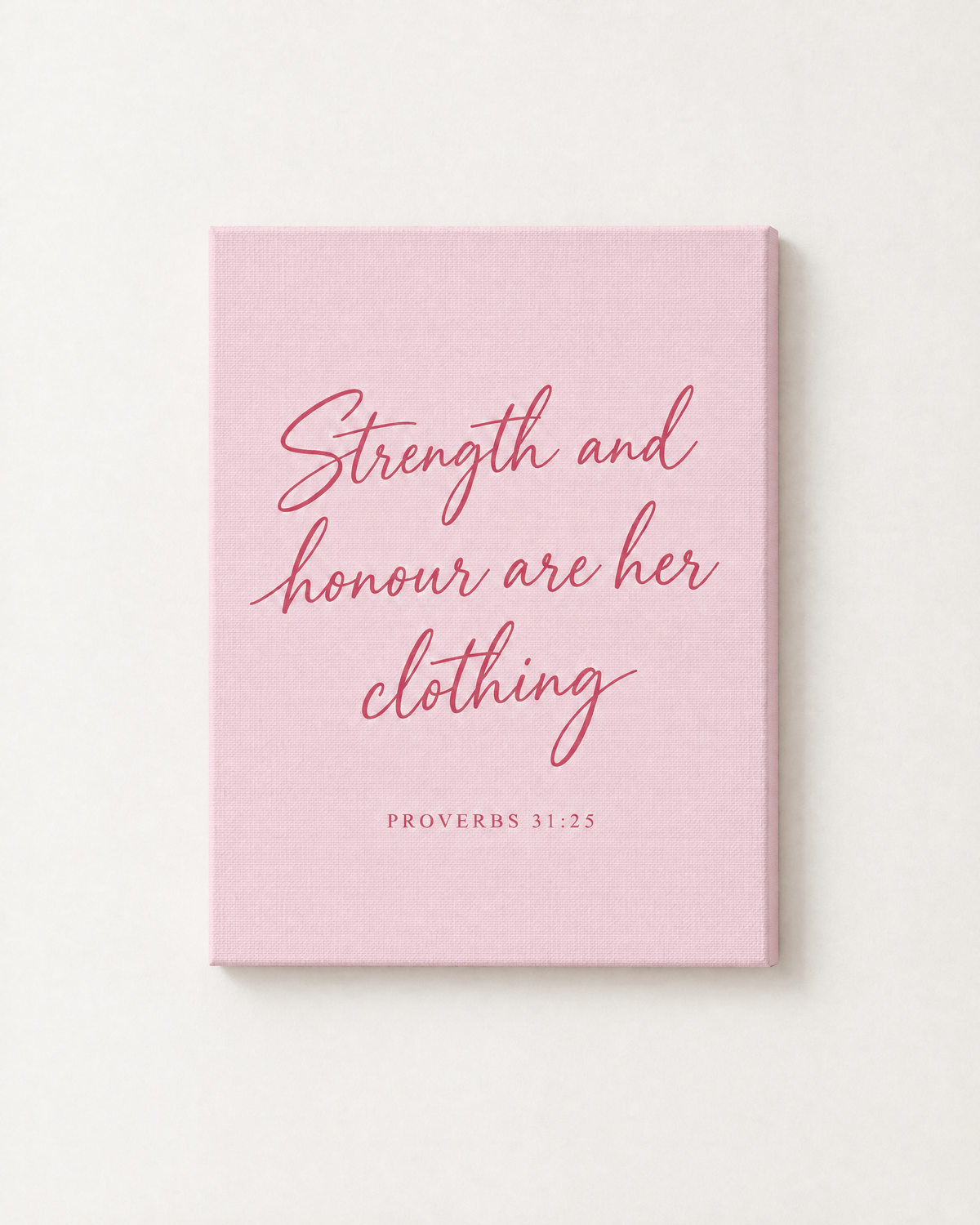 Strength and Honour: Blush print as a gallery-wrapped canvas on a white wall, reading “Strength and honour are her clothing” (Proverbs 31:25, KJV). Digital mockup.
