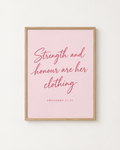 Strength and Honour: Blush print in an oak frame on a white wall, reading “Strength and honour are her clothing” (Proverbs 31:25, KJV). Digital mockup.
