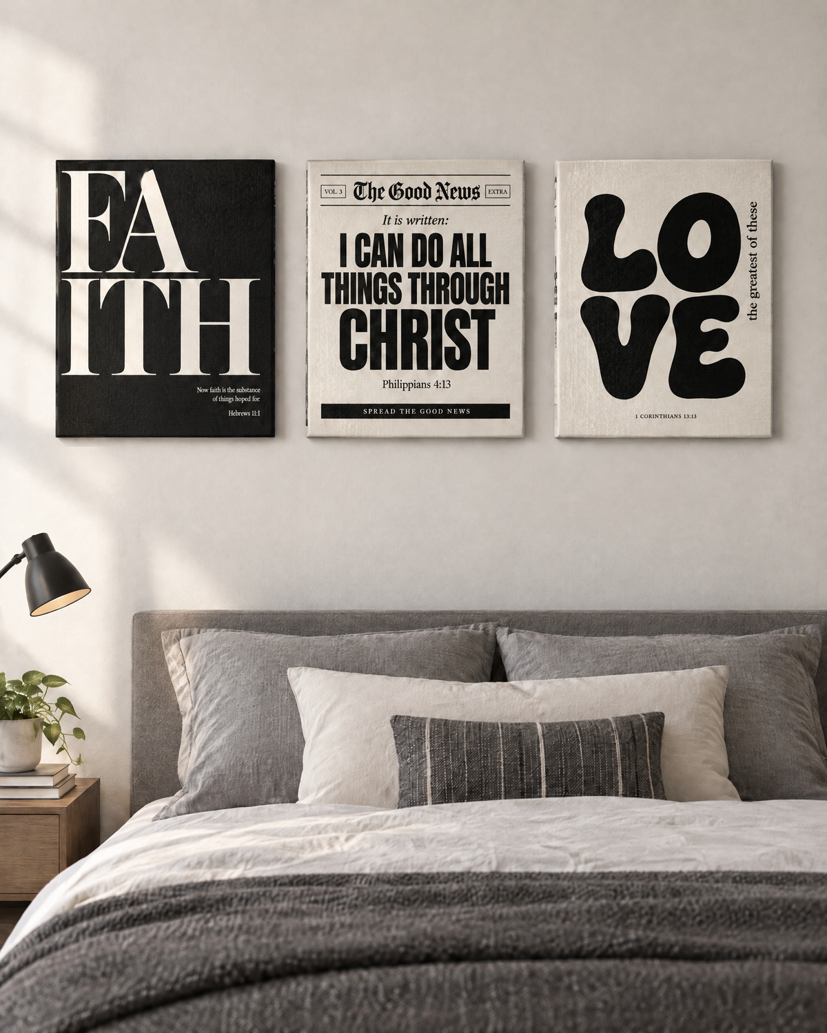 Digital mockup: the Black & White Set of 3 as gallery-wrapped canvases above a bed: FAITH (Hebrews 11:1), “I can do all things through Christ” (Philippians 4:13) and LOVE “the greatest of these” (1 Corinthians 13:13).